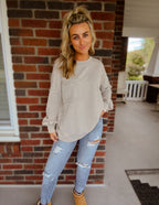 Acid wash raw edge front pocket pullover