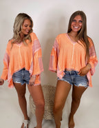 It's a vibe frayed edge top- Coral