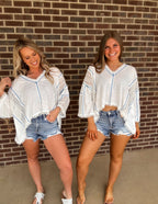 It's a vibe frayed edge top- ivory