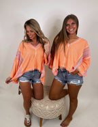 It's a vibe frayed edge top- Coral