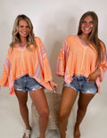 It's a vibe frayed edge top- Coral